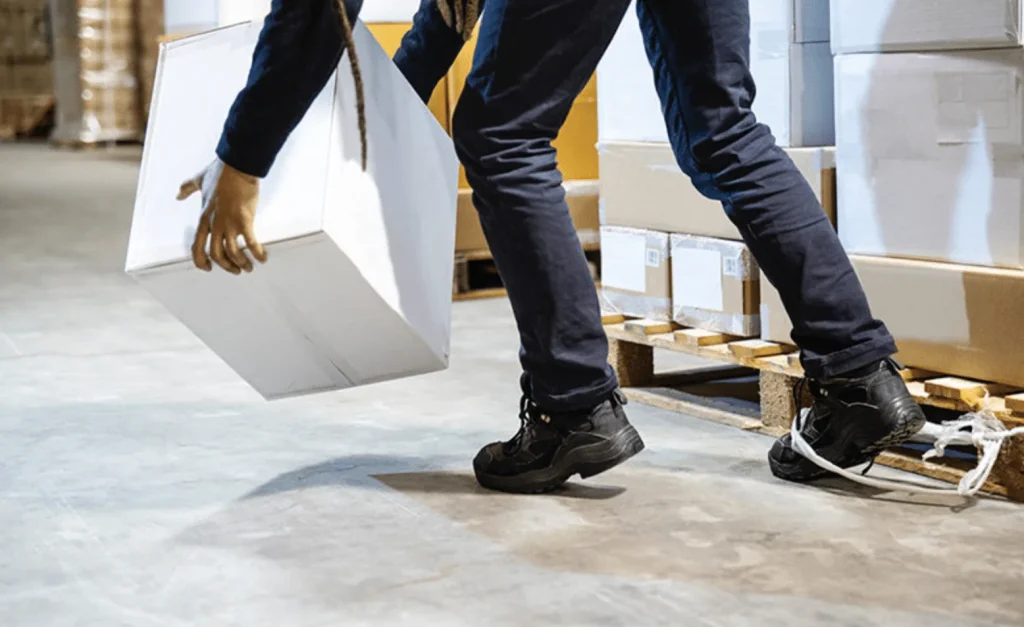 warehouse-worker-lifting-box